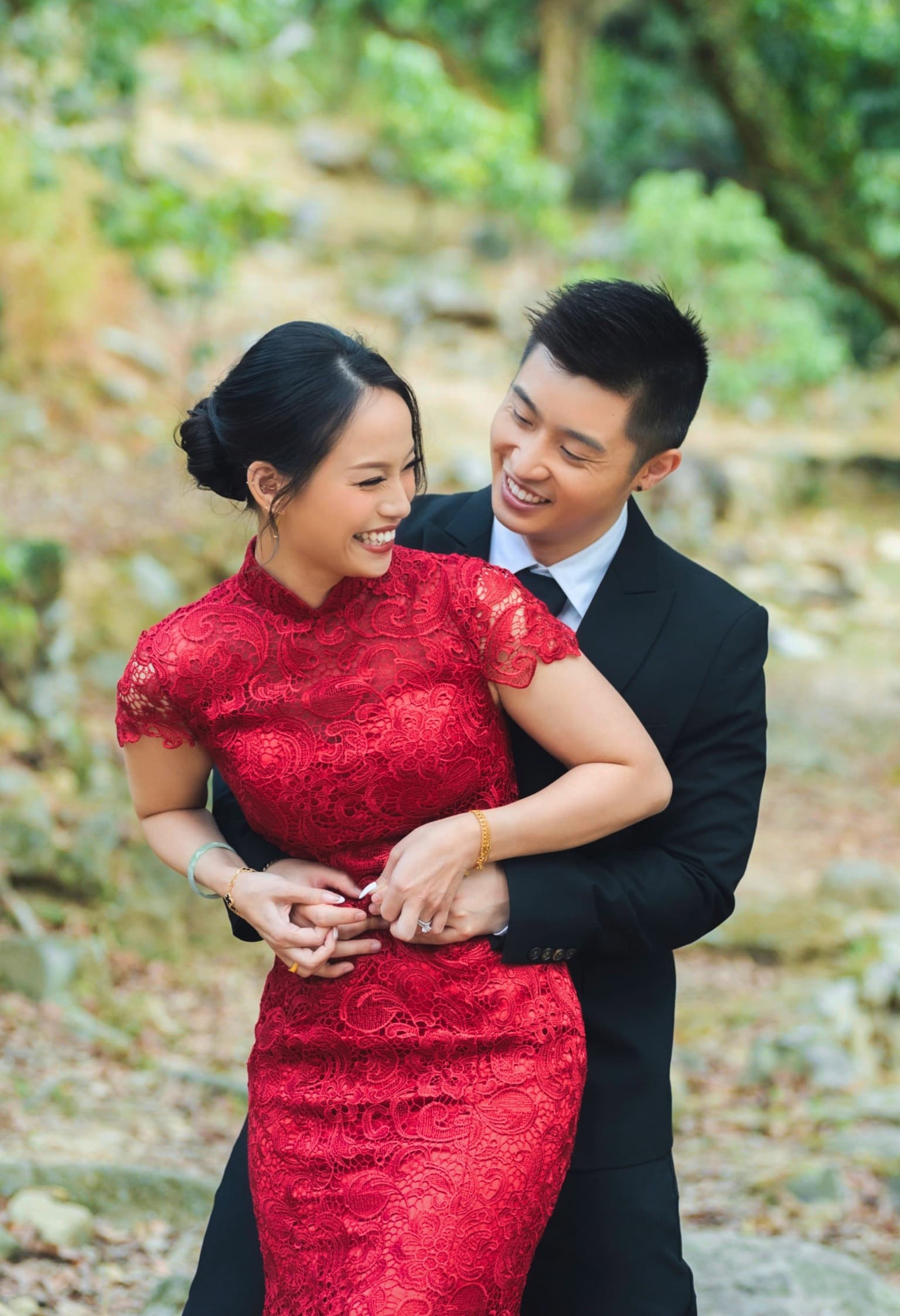 Laughing embrace in the forest